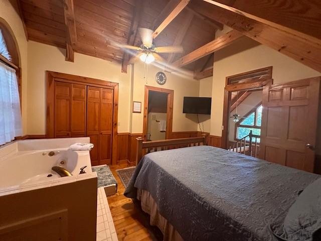 10 Meadow Brook Ln, Spencer, TN 38585 - bedroom featuring a wainscoted wall, light wood-type flooring, wood ceiling, and ceiling fan