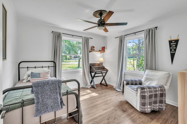 4200 Hunters Point Pike, Lebanon, TN 37087 - bedroom featuring multiple windows, wood finished floors, ornamental molding, and ceiling fan