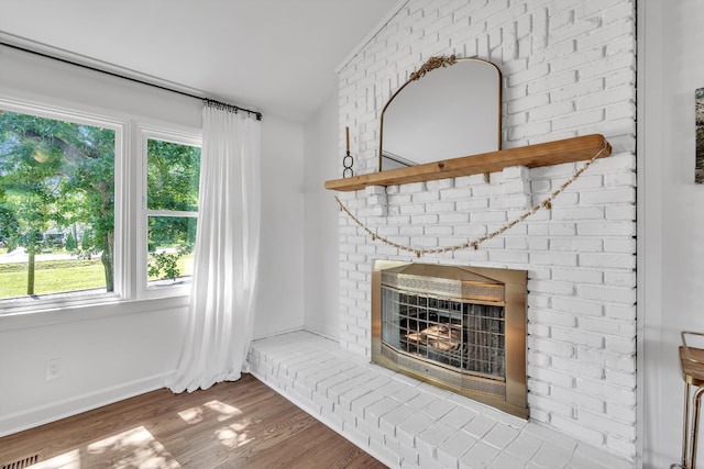 4200 Hunters Point Pike, Lebanon, TN 37087 - unfurnished living room with wood finished floors, a fireplace, and lofted ceiling