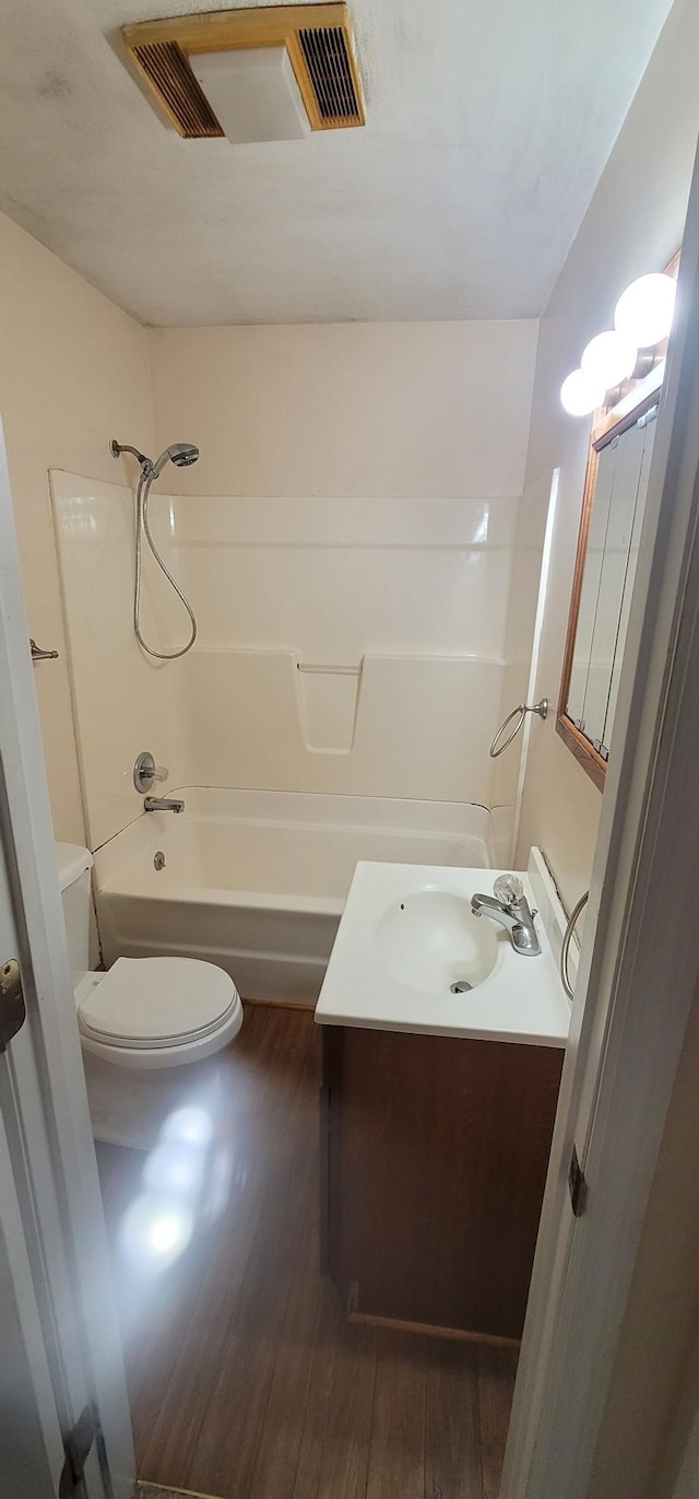 205 Galen Rd, Lafayette, TN 37083 - bathroom with vanity, wood finished floors, and  shower combination