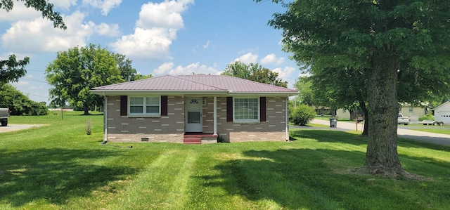 205 Galen Rd, Lafayette, TN 37083 - view of front of property with a front lawn, a metal roof, and brick siding