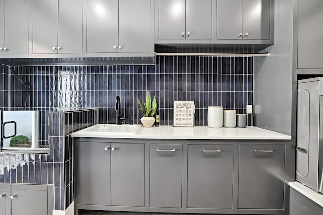4720 Edwardian Trce, Franklin, TN 37067 - kitchen with gray cabinetry, backsplash, and light countertops