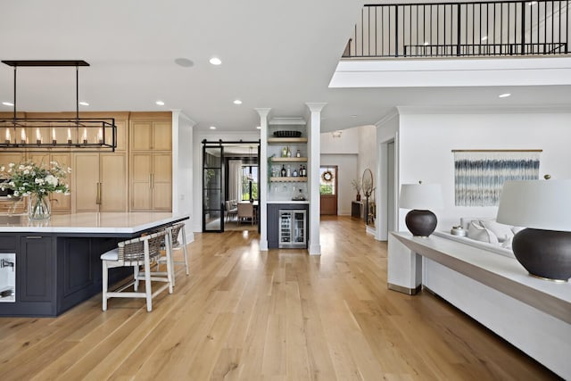 4720 Edwardian Trce, Franklin, TN 37067 - kitchen featuring wine cooler, light wood finished floors, crown molding, light countertops, and recessed lighting