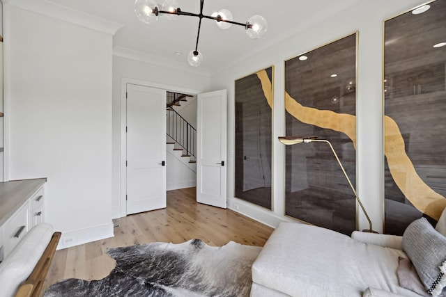 4720 Edwardian Trce, Franklin, TN 37067 - bedroom featuring ornamental molding, light wood-style floors, and a chandelier