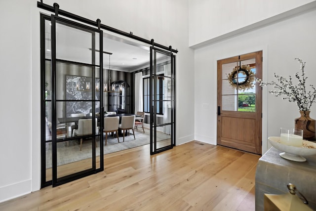 4720 Edwardian Trce, Franklin, TN 37067 - entryway with a barn door and wood finished floors