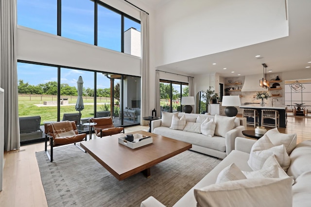 4720 Edwardian Trce, Franklin, TN 37067 - living area featuring a towering ceiling, recessed lighting, and wood finished floors