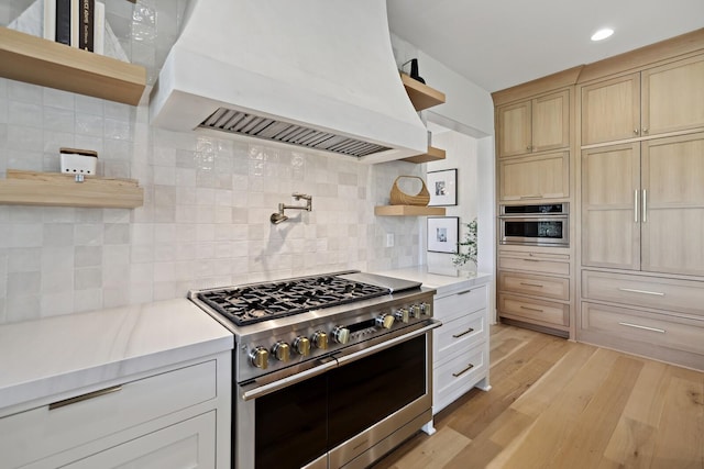 4720 Edwardian Trce, Franklin, TN 37067 - kitchen featuring open shelves, double oven range, custom exhaust hood, light countertops, and recessed lighting