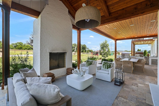 4720 Edwardian Trce, Franklin, TN 37067 - view of patio / terrace with an outdoor brick fireplace and an outdoor kitchen