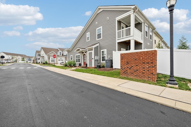 100 Bergen Dr, Spring Hill, TN 37174 - view of front of house with a balcony, a residential view, and brick siding