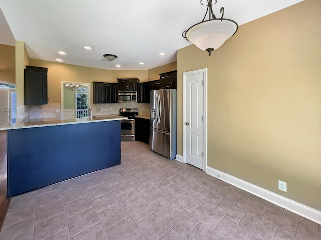 3624 Prestwicke Pl, Adams, TN 37010 - kitchen with appliances with stainless steel finishes, decorative backsplash, dark cabinets, a peninsula, and recessed lighting