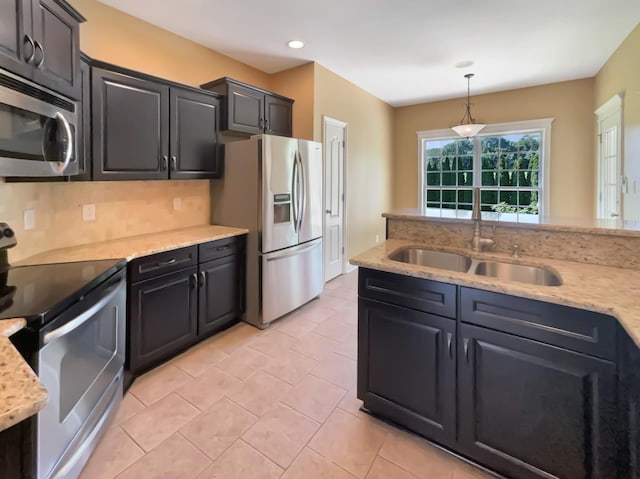 3624 Prestwicke Pl, Adams, TN 37010 - kitchen featuring stainless steel appliances, decorative light fixtures, light tile patterned flooring, light stone countertops, and recessed lighting