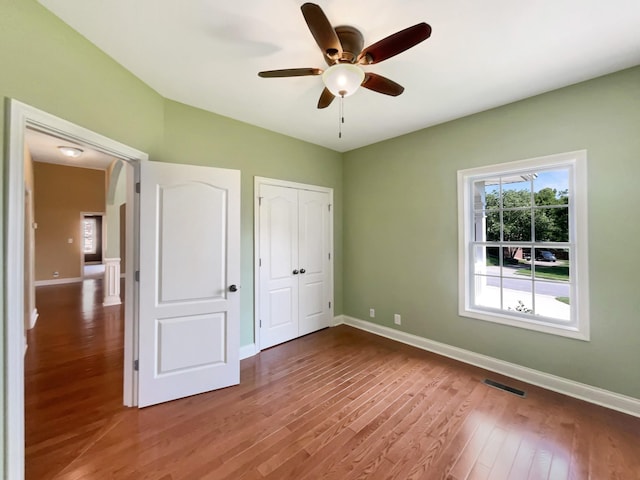 3624 Prestwicke Pl, Adams, TN 37010 - unfurnished bedroom featuring wood finished floors, ceiling fan, and a closet
