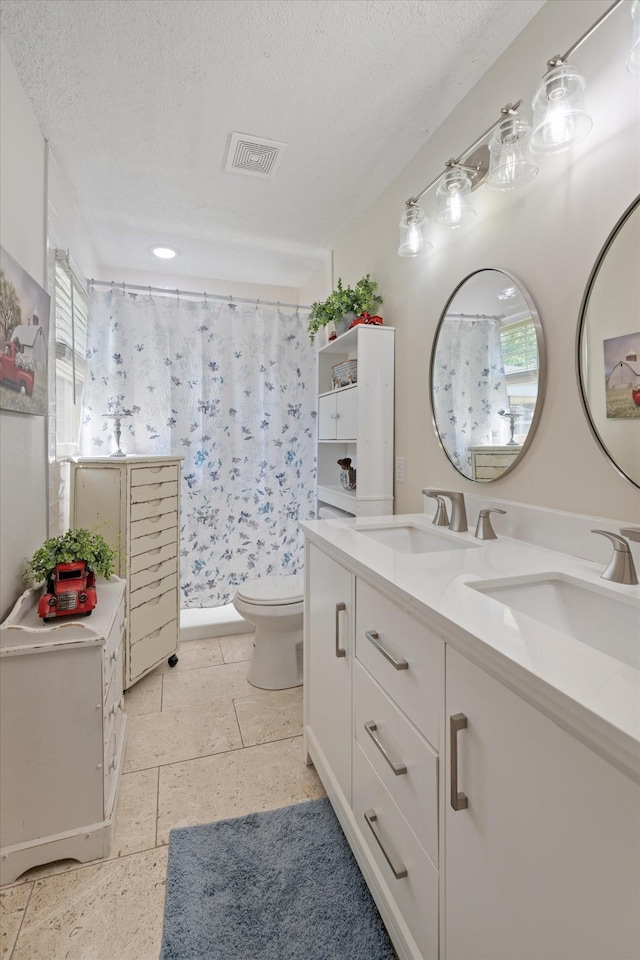 106 Mcfarlin Rd, Murfreesboro, TN 37130 - bathroom featuring double vanity, a textured ceiling, and a shower with curtain