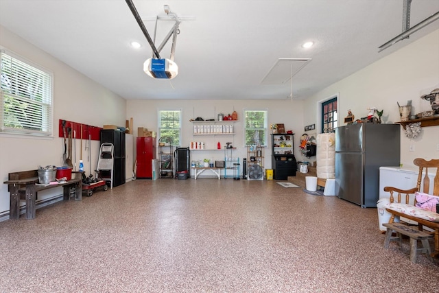 106 Mcfarlin Rd, Murfreesboro, TN 37130 - garage with freestanding refrigerator, a garage door opener, and recessed lighting