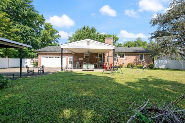 106 Mcfarlin Rd, Murfreesboro, TN 37130 - rear view of house with a garage, brick siding, a chimney, and a patio