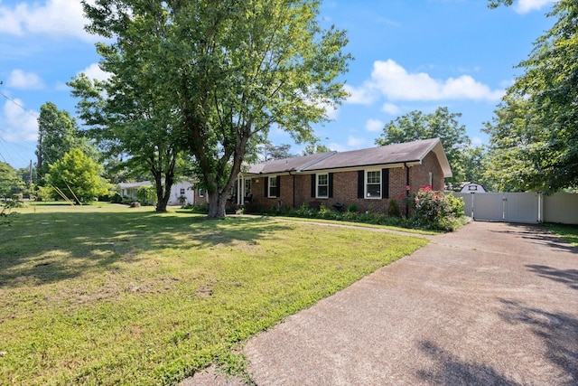 106 Mcfarlin Rd, Murfreesboro, TN 37130 - single story home with a gate, a front lawn, brick siding, and asphalt driveway