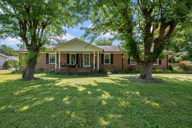 106 Mcfarlin Rd, Murfreesboro, TN 37130 - ranch-style house featuring a porch, a front yard, and brick siding