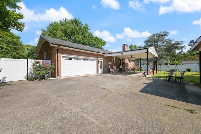 106 Mcfarlin Rd, Murfreesboro, TN 37130 - view of front of home featuring brick siding, a chimney, a garage, and driveway