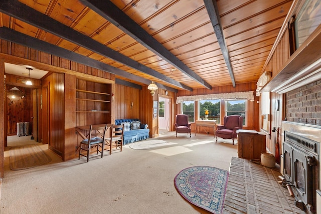 266 Clear Creek Cir, Pulaski, TN 38478 - carpeted living area with radiator heating unit, wood walls, built in features, a wood ceiling with exposed beams, and a fireplace