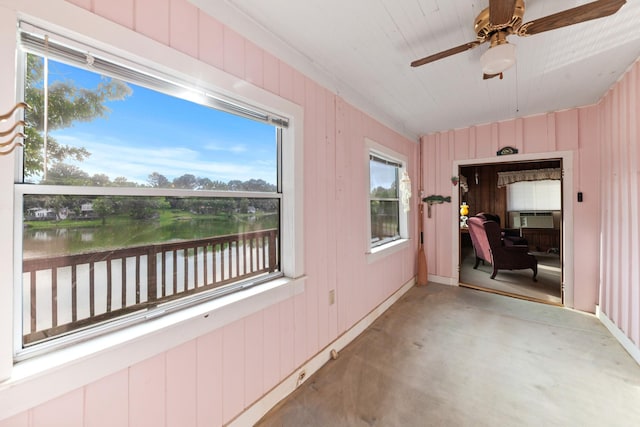 266 Clear Creek Cir, Pulaski, TN 38478 - unfurnished sunroom with finished concrete flooring, a water view, a ceiling fan, cooling unit, and wood walls