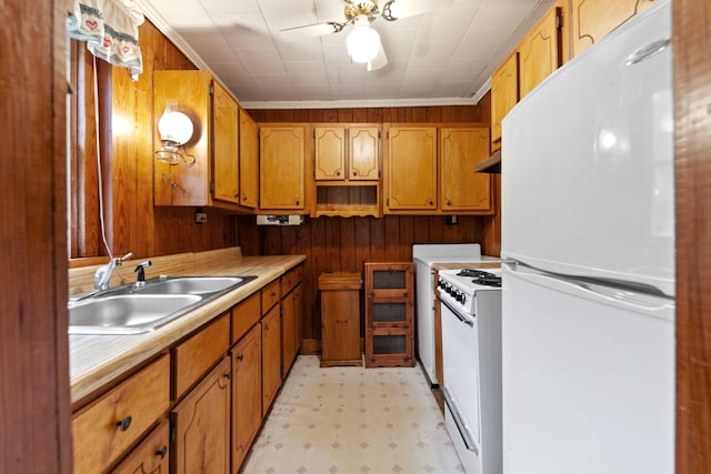 266 Clear Creek Cir, Pulaski, TN 38478 - kitchen featuring white appliances, ceiling fan, light flooring, light countertops, and brown cabinetry