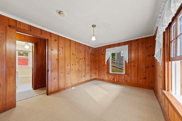 266 Clear Creek Cir, Pulaski, TN 38478 - empty room featuring ornamental molding, light carpet, wooden walls, and a smoke detector