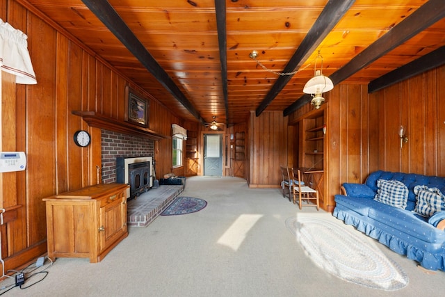 266 Clear Creek Cir, Pulaski, TN 38478 - living area with wood walls, light carpet, and a wood ceiling with exposed beams