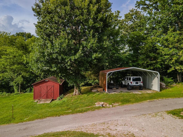 266 Clear Creek Cir, Pulaski, TN 38478 - view of car parking featuring a storage shed, a carport, and driveway