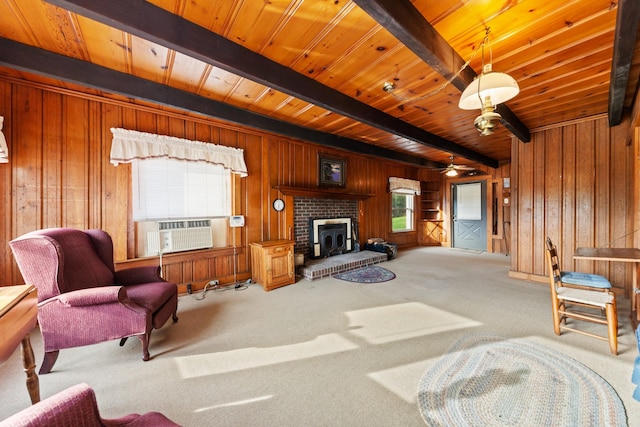 266 Clear Creek Cir, Pulaski, TN 38478 - living area with a wood ceiling with exposed beams, wooden walls, cooling unit, carpet floors, and a fireplace