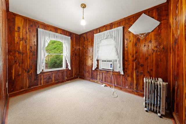 266 Clear Creek Cir, Pulaski, TN 38478 - carpeted empty room featuring radiator heating unit, wood walls, and cooling unit