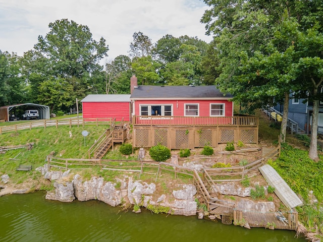 266 Clear Creek Cir, Pulaski, TN 38478 - rear view of property with a deck with water view, a detached carport, stairway, and a chimney