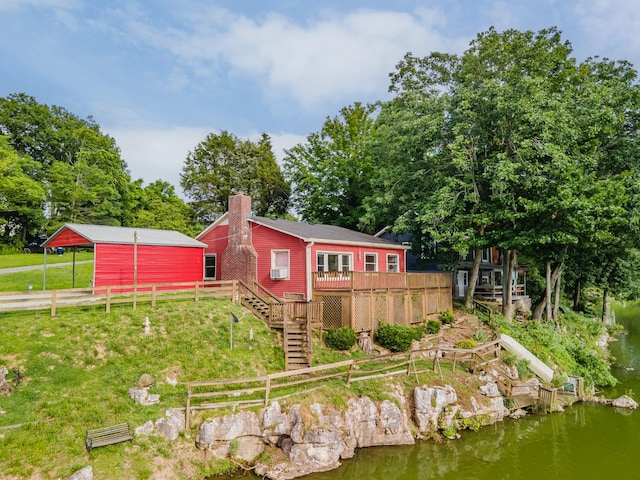 266 Clear Creek Cir, Pulaski, TN 38478 - back of property featuring a deck with water view, a chimney, and stairway