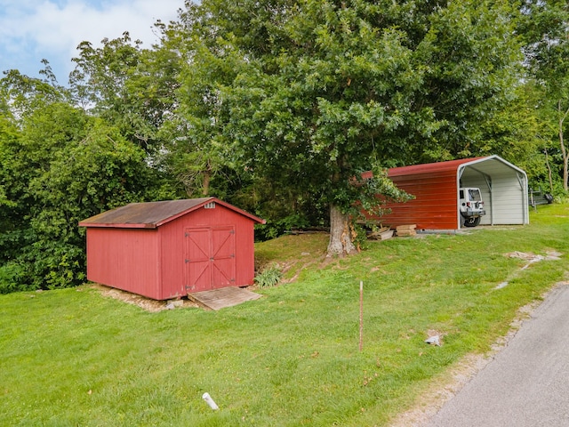 266 Clear Creek Cir, Pulaski, TN 38478 - view of green lawn featuring a shed and a detached carport