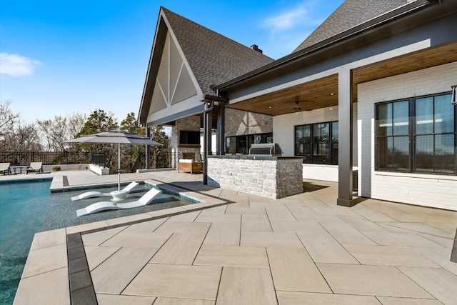 2996 S Rutland Rd, Mount Juliet, TN 37122 - view of swimming pool with an outdoor kitchen, a patio, and a ceiling fan