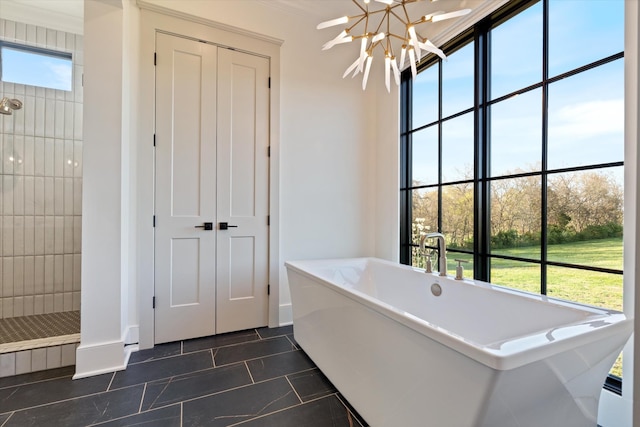 2996 S Rutland Rd, Mount Juliet, TN 37122 - full bath featuring a soaking tub, tiled shower, tile patterned flooring, and a chandelier