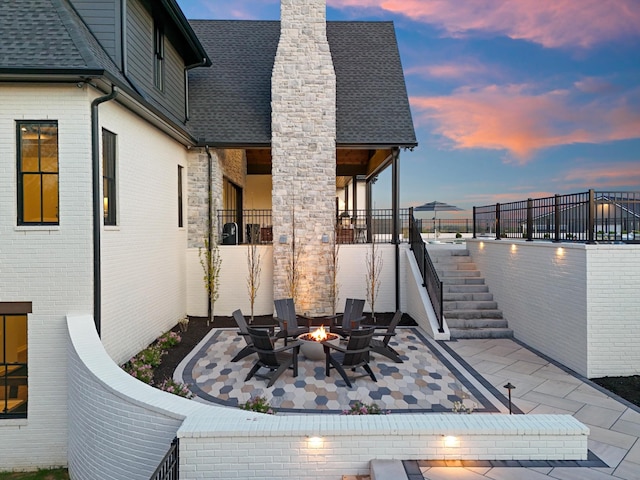 2996 S Rutland Rd, Mount Juliet, TN 37122 - patio terrace at dusk featuring a patio area, a fire pit, and stairway