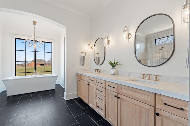 2996 S Rutland Rd, Mount Juliet, TN 37122 - bathroom with double vanity, ornamental molding, a freestanding tub, healthy amount of natural light, and a chandelier