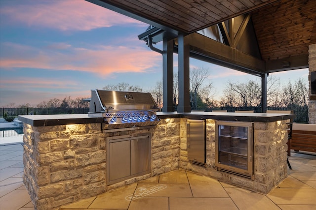 2996 S Rutland Rd, Mount Juliet, TN 37122 - patio terrace at dusk featuring area for grilling, a patio area, a gazebo, and beverage cooler