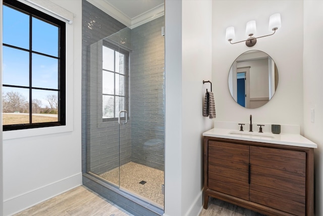 2996 S Rutland Rd, Mount Juliet, TN 37122 - bathroom with wood finished floors, a stall shower, vanity, and ornamental molding
