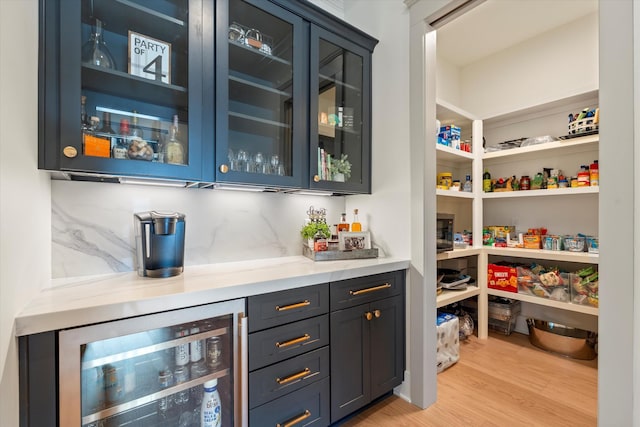 2996 S Rutland Rd, Mount Juliet, TN 37122 - indoor dry bar featuring beverage cooler, light wood-style floors, and backsplash