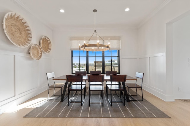 2996 S Rutland Rd, Mount Juliet, TN 37122 - dining space with a decorative wall, a chandelier, wood finished floors, ornamental molding, and recessed lighting