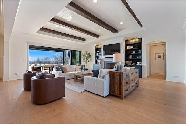 2996 S Rutland Rd, Mount Juliet, TN 37122 - living room with arched walkways, light wood-style floors, a wooden ceiling with exposed beams, a fireplace, and built in features
