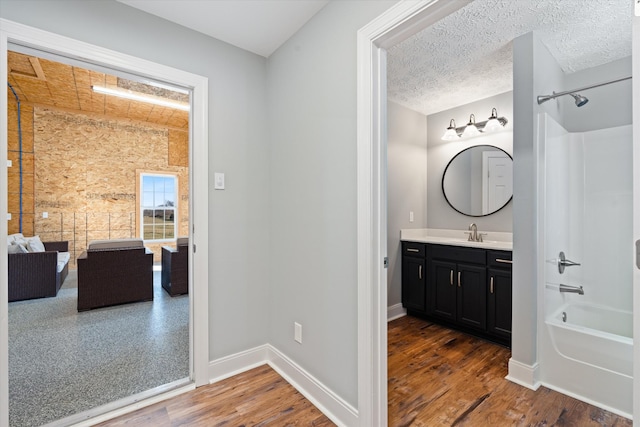 2996 S Rutland Rd, Mount Juliet, TN 37122 - bathroom featuring vanity, bathing tub / shower combination, and wood finished floors
