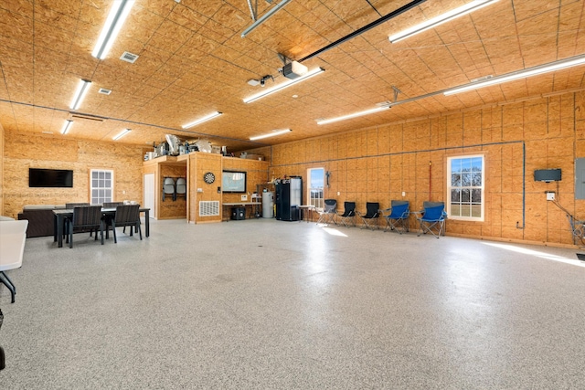 2996 S Rutland Rd, Mount Juliet, TN 37122 - garage featuring electric panel, water heater, and a garage door opener