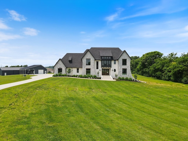 2996 S Rutland Rd, Mount Juliet, TN 37122 - french country inspired facade with stone siding, a front lawn, driveway, and a garage