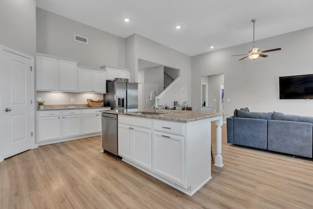 272 Thorpe Dr, Spring Hill, TN 37174 - kitchen featuring stainless steel appliances, a high ceiling, open floor plan, ceiling fan, and a kitchen breakfast bar