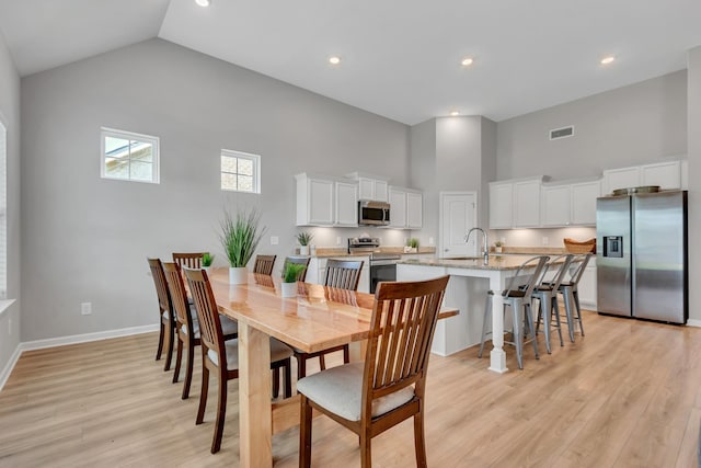 272 Thorpe Dr, Spring Hill, TN 37174 - dining space featuring high vaulted ceiling, light wood finished floors, and recessed lighting
