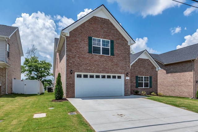 272 Thorpe Dr, Spring Hill, TN 37174 - traditional home with driveway, brick siding, and a garage