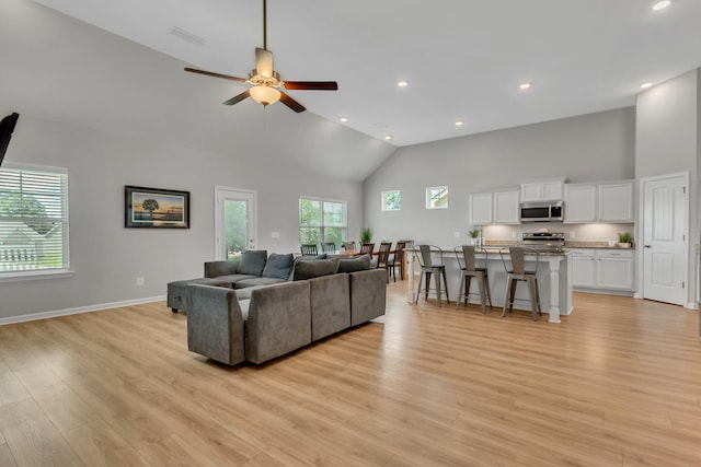 272 Thorpe Dr, Spring Hill, TN 37174 - living room featuring light wood finished floors, ceiling fan, high vaulted ceiling, and recessed lighting