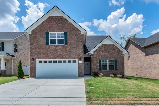 272 Thorpe Dr, Spring Hill, TN 37174 - view of front of home with driveway, brick siding, a front lawn, and a garage